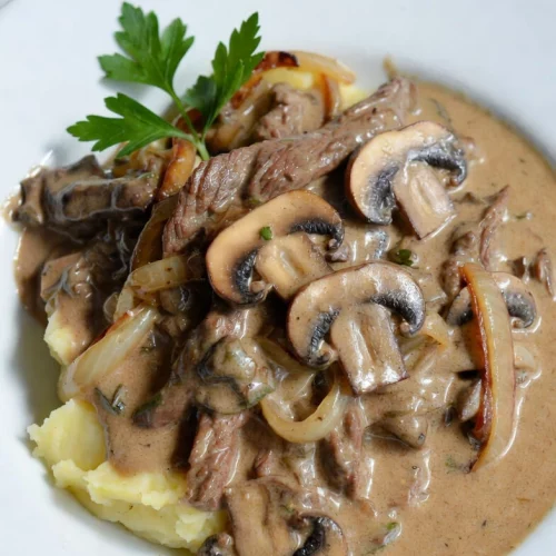 Close-up of creamy potato beef stroganoff sauce and tender beef