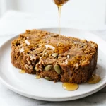Pumpkin bread slice with honey drizzle
