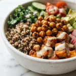 Close-up texture of quinoa, chickpeas, and tahini dressing
